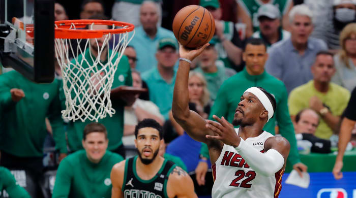 Heat’s Jimmy Butler shoots in front of Celtics’ Jayson Tatum.